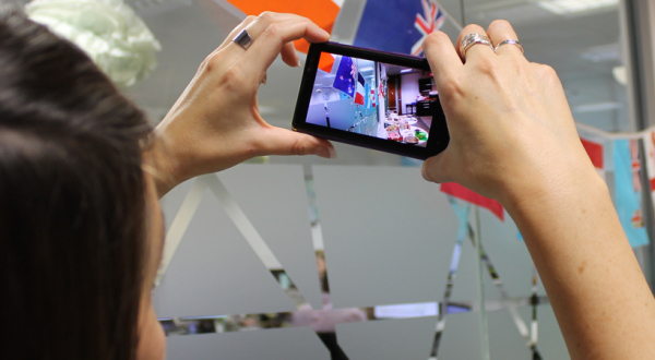 Someone taking a picture of various country flags